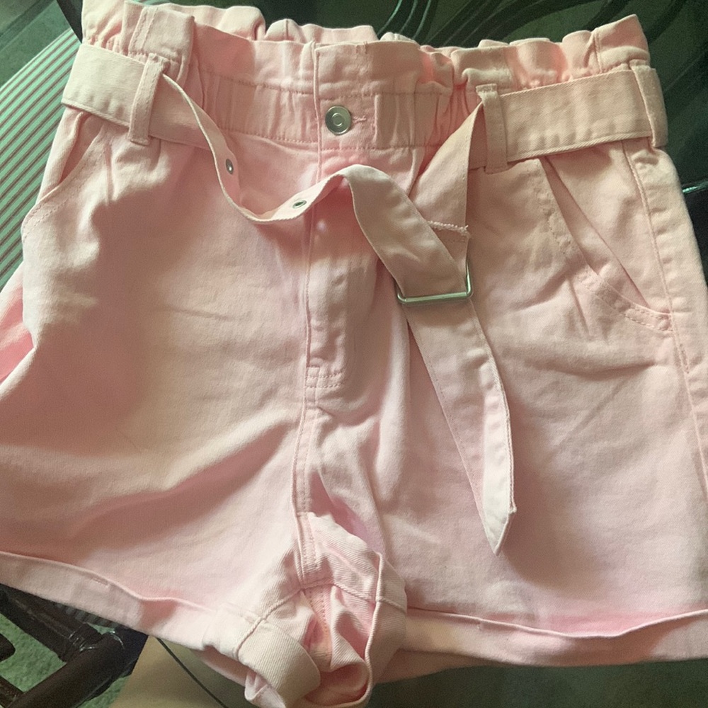 High waisted pink shorts with belt.